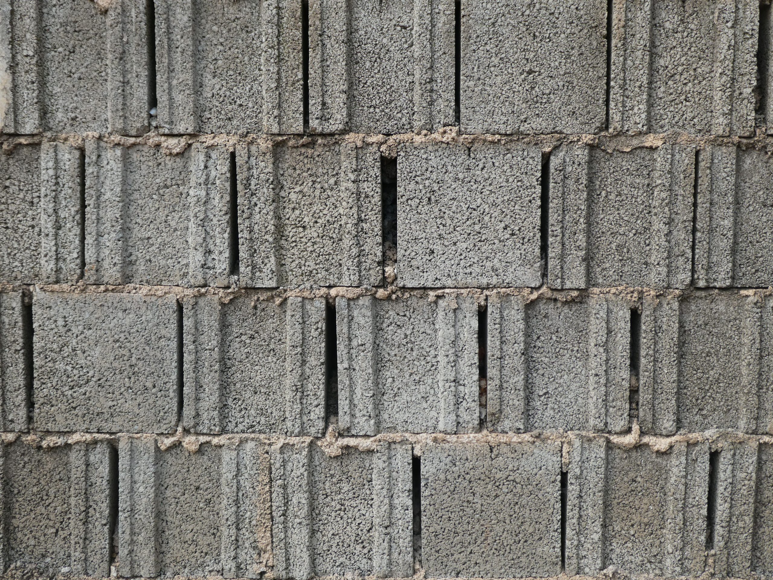 Mur parpaing gris texture rugueuse construction